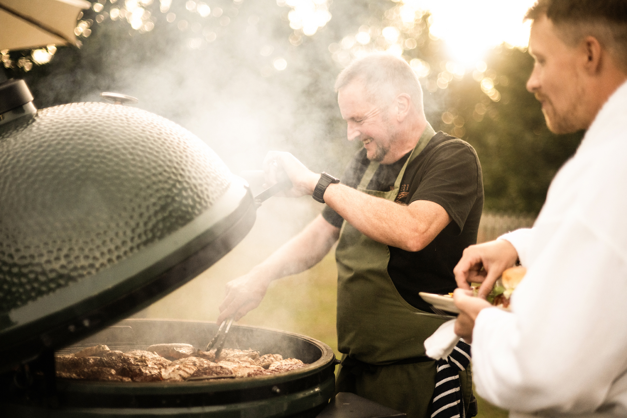 A chef cooking a Christmas BBQ on the terrace.